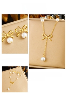 Detailed view of gold plated bowknot jewelry set with pearls and delicate chains
