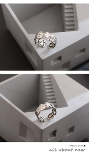 Detail of vintage silver gingerbread man ring showing S925 engraving and 3D relief design