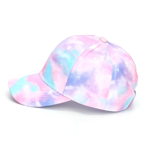 Side view of kids' tie-dye baseball cap with pink, blue, and purple nebula print