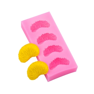 Pink silicone mold for making 4 orange segment shapes for fondant cake decorating