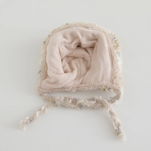 Detailed close-up of thick pink plush lining and fuzzy knit texture of the baby winter hat