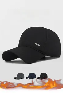 Detailed view of thermal ear flap baseball caps in black, grey, and navy blue wool