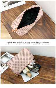 Detail showing high-capacity interior of pink cylindrical pouch with geometric prints