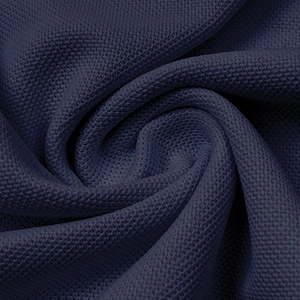 Close-up of navy blue breathable mesh fabric showing the honeycomb knit texture