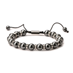 Handmade tiger eye hematite beaded bracelet with adjustable black braided cord on white background