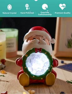 Detail of Santa Claus night light with white crystal stones inside and soft warm glow