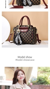 Detail view of large checkered handbag featuring silk scarf and gold brand plaque