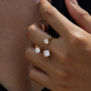 Elegant gold-plated open ring featuring three round zircons on a model's finger
