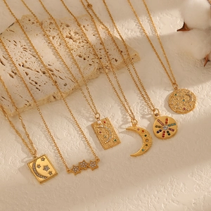 Gold celestial necklace set with moon star sun charms and colorful rhinestones