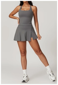 Detail view of charcoal grey sports skort with side slit and inner safety shorts