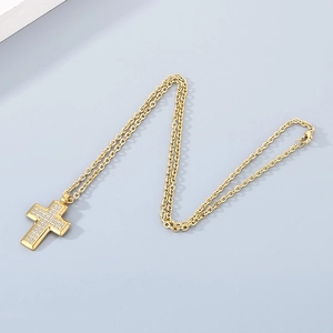 Detailed view of a gold-plated titanium steel cross necklace with inlaid cubic zirconia