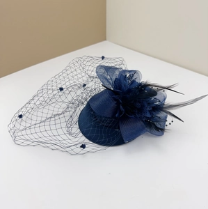 Elegant navy blue vintage fascinator hat with delicate mesh veil and feather accents