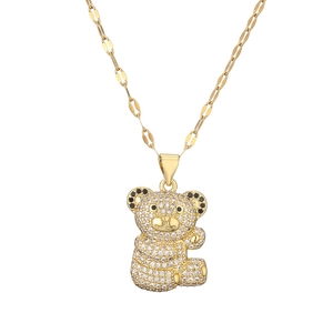 Charming gold bear necklace with white micro-pave crystals on a minimalist chain link