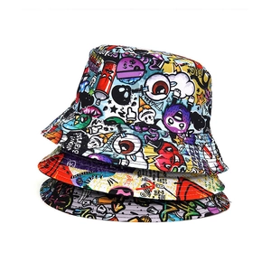 Detail of vibrant graffiti print bucket hats showing colorful street art pattern texture