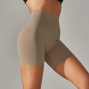 Close-up of high-waist yoga shorts in khaki showing sculpting fit and matte fabric