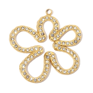 Detailed view of a gold flower pendant featuring pave-set sparkling white crystals