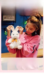 Close-up of soft plush white bunny toy made of premium elastic velvet fabric