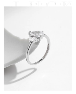 Macro shot of S925 sterling silver ring featuring teardrop crystals and engraved size 6