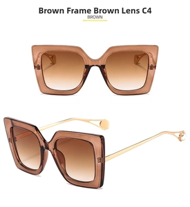 Detail of square brown gradient lenses with gold temples and white pearl accents