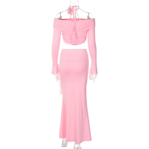 Rear view of pink two-piece set featuring long sleeve off-shoulder top and maxi skirt