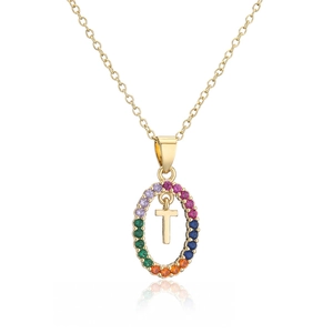 Macro shot of gold oval pendant featuring rainbow cubic zirconia and a movable letter T charm