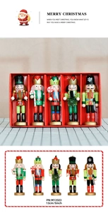 Detailed view of 5-piece 13cm wooden nutcracker set in festive red gift box packaging