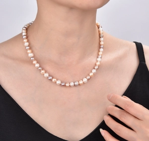 Detailed view of 925 silver necklace featuring white pink and purple freshwater pearls