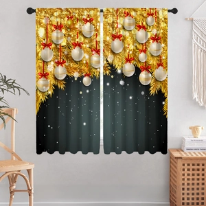 Detail of Christmas curtains with golden branches and red ribbon ornaments on green fabric