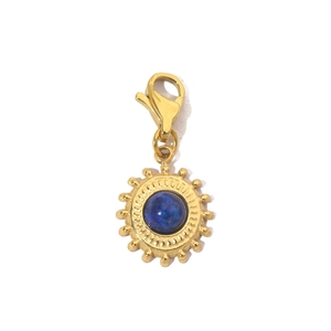 Detail of sun-shaped gold stainless steel pendant with blue stone and lobster clasp