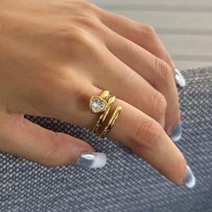 Three-layer wrap gold ring with heart-shaped zircon on finger lifestyle display