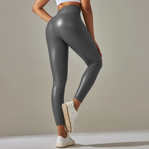 Close-up of high-waisted dark grey faux leather leggings with premium shiny texture