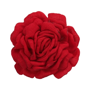 Detailed macro view of the realistic red fabric rose hair clip with layered petals