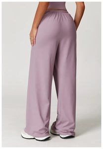 Back view of high-waisted wide-leg lounge pants in lavender with elastic drawstring waist