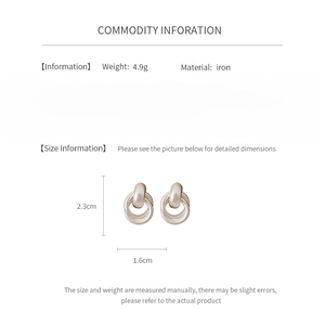 Detailed view of silver matte geometric hoop earrings with dimensions and material specs
