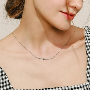 Minimalist S925 sterling silver star necklace with blue turquoise pendant on model