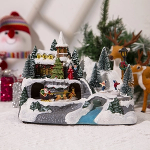 Christmas musical house village with LED lights, Santa sleigh, and miniature snow scene