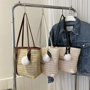 Minimalist straw tote bags with Summer embroidery and pom pom charms in three colors