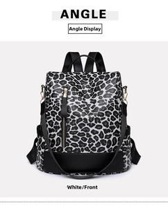 Front angle of a leopard print women backpack with black leather trim and gold zippers