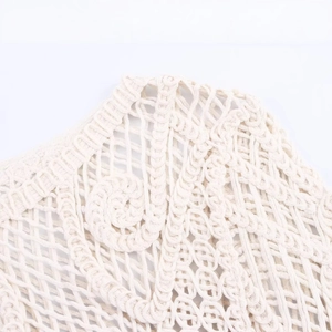 Bohemian cream crochet long sleeve top with intricate hollow mesh and spiral knit patterns
