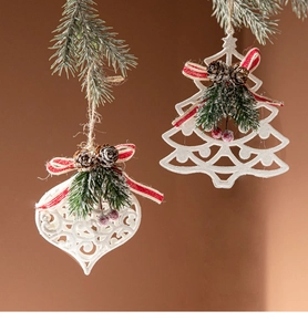 Detailed Christmas tree ornaments with pine needles, cones, and red berries on white hearts
