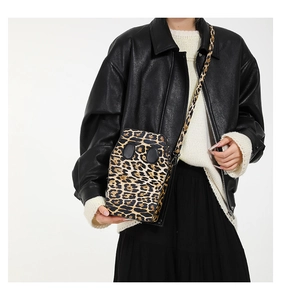 Detailed view of the coffin-shaped crossbody bag featuring a leopard print design