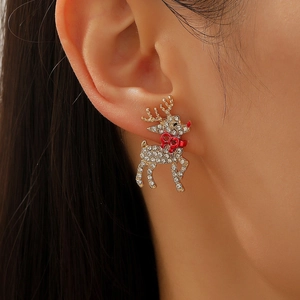 Sparkling reindeer stud earring with gold metal and crystals worn on woman's ear