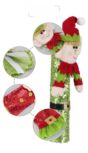 Detail of Christmas elf handle covers with green sequins and velcro closure for home decor