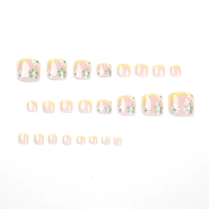 French style toe nails with yellow tips and white green daisy patterns on pink base