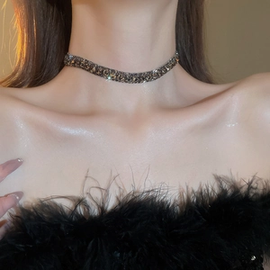 Close-up of a luxury square zircon choker necklace on a model's neck for a trendy look