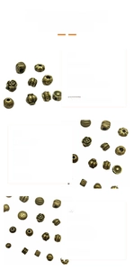 Detailed view of antique bronze alloy spacer beads with rose and scroll floral patterns