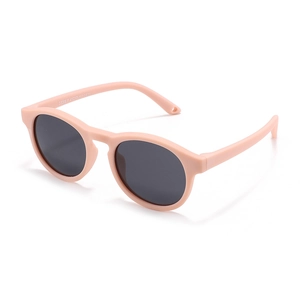 Retro round silicone kids sunglasses in nude pink with dark grey UV lenses