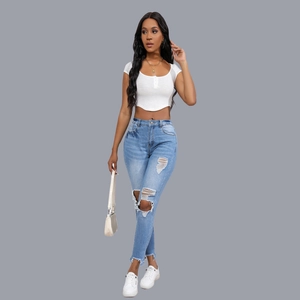 Full view of slim fit white crop top and high waist ripped denim jeans for women