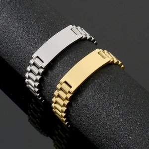 Macro view of polished stainless steel watch band bracelets in silver and gold finishes