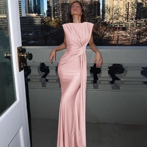 Detail of elegant pink sleeveless satin maxi dress with waist ruching and twist knot detail